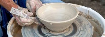 Man using potters wheel.