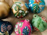 Adult paint a bauble with prosecco
